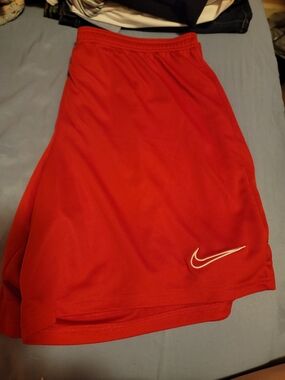 Nike Red Athletic Shorts with White Swoosh